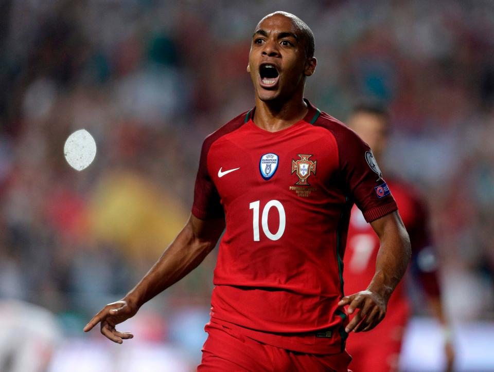  Midfielder Joao Mario celebrates reaching the World Cup finals again