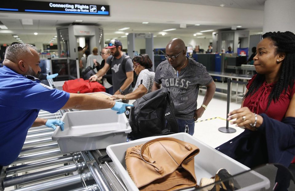  Trays often emerge quicker than passengers as they wait to pass through body scanners