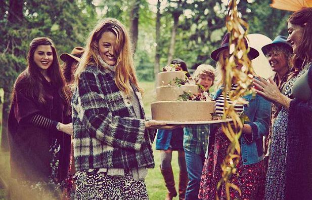  Blake was pictured carrying a three-tier cake surrounded by friends and family