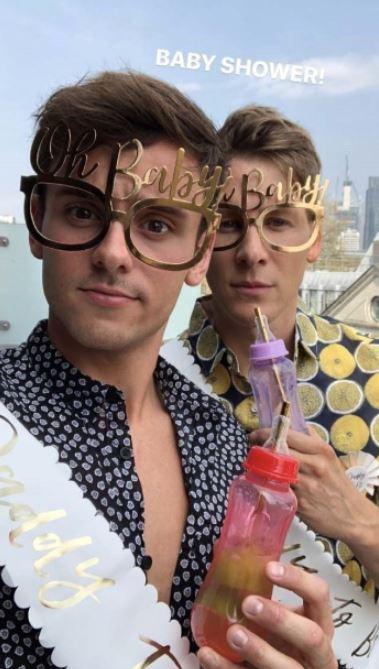  Tom Daley and Dustin Lance Blac both wore sashes emblazoned with the words 'Daddy to be' and gold glasses saying 'Oh baby!' at their baby shower