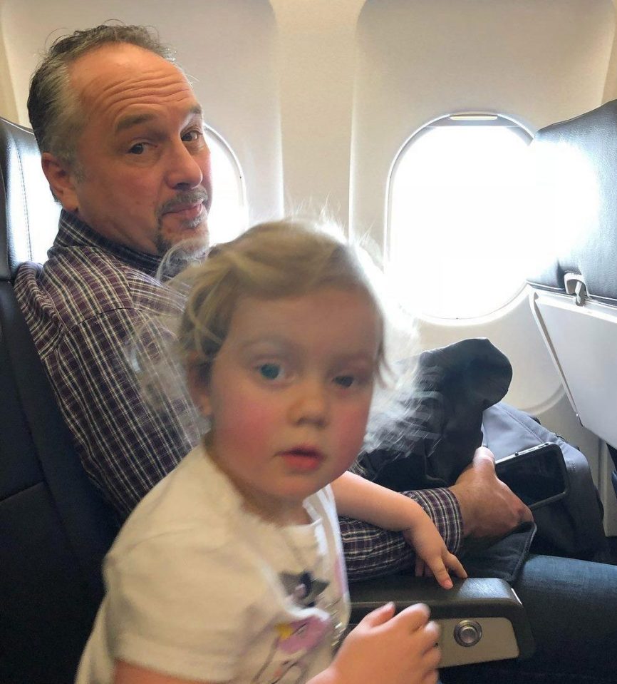  Jessica Rudeen shared this picture of the kind man who helped stop her three year old Caroline, pictured, from screaming on a flight