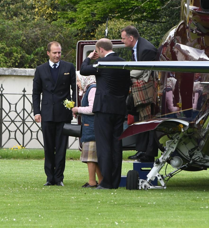  She was saluted as she disembarked from her private helicopter