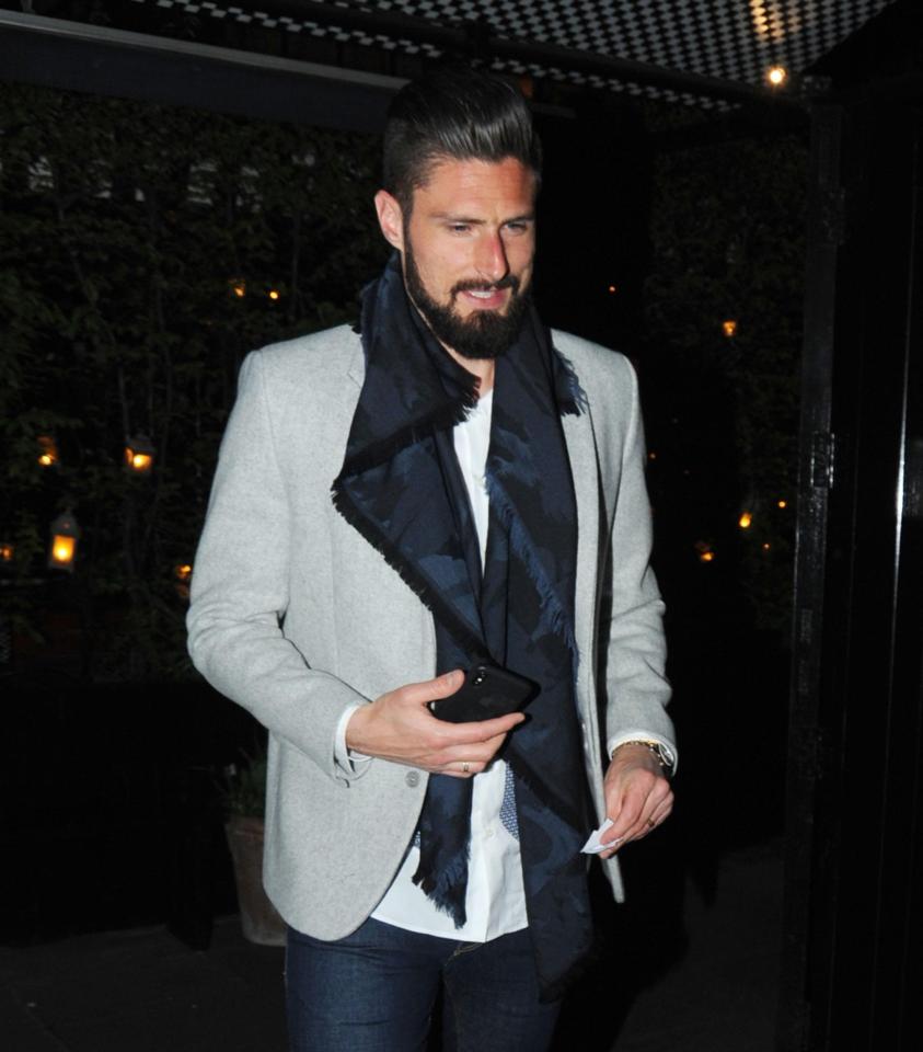 Giroud looked delighted ahead of sampling the delicious menu