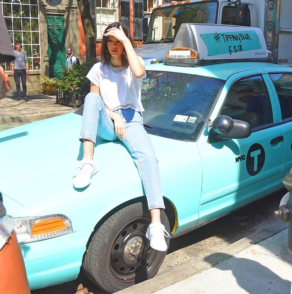 She posed on top of a Tiffany blue taxi