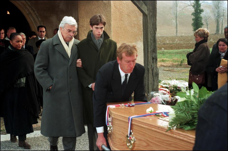  Sophie's husband Daniel Toscan du Plantier and his son stand arm-in-arm at her funeral