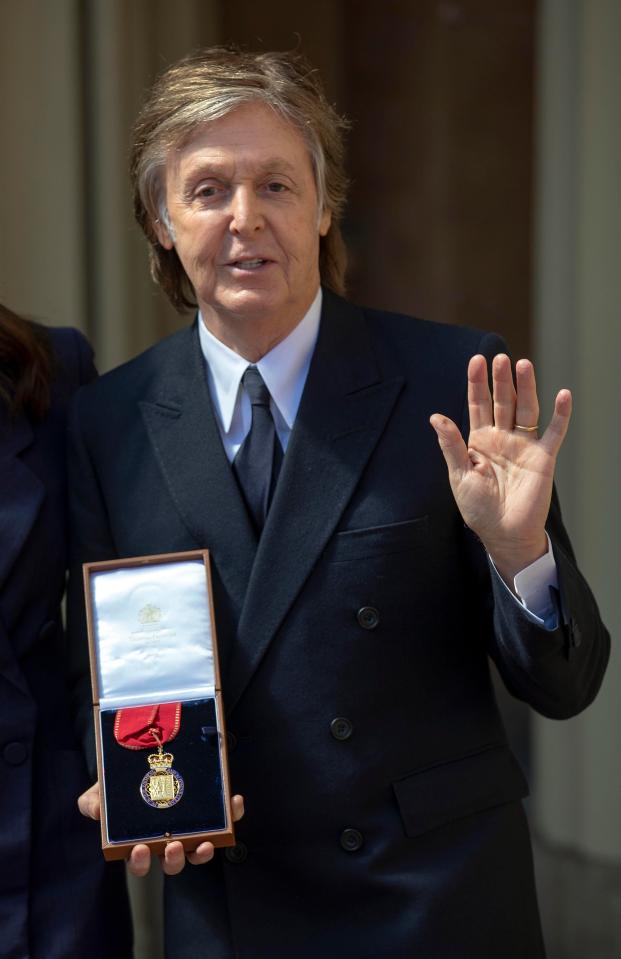  Sir Paul wore a tailored navy double-breasted suit which was designed by his daughter Stella