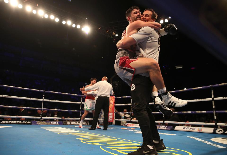  Trainer Tony Sims celebrates with John Ryder after the bout came to an end in dramatic fashion