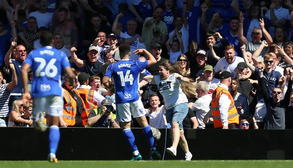 Birmingham celebrate after Che Adams gets the late goal that seals a 3-1 win over Fulham and Championship survival