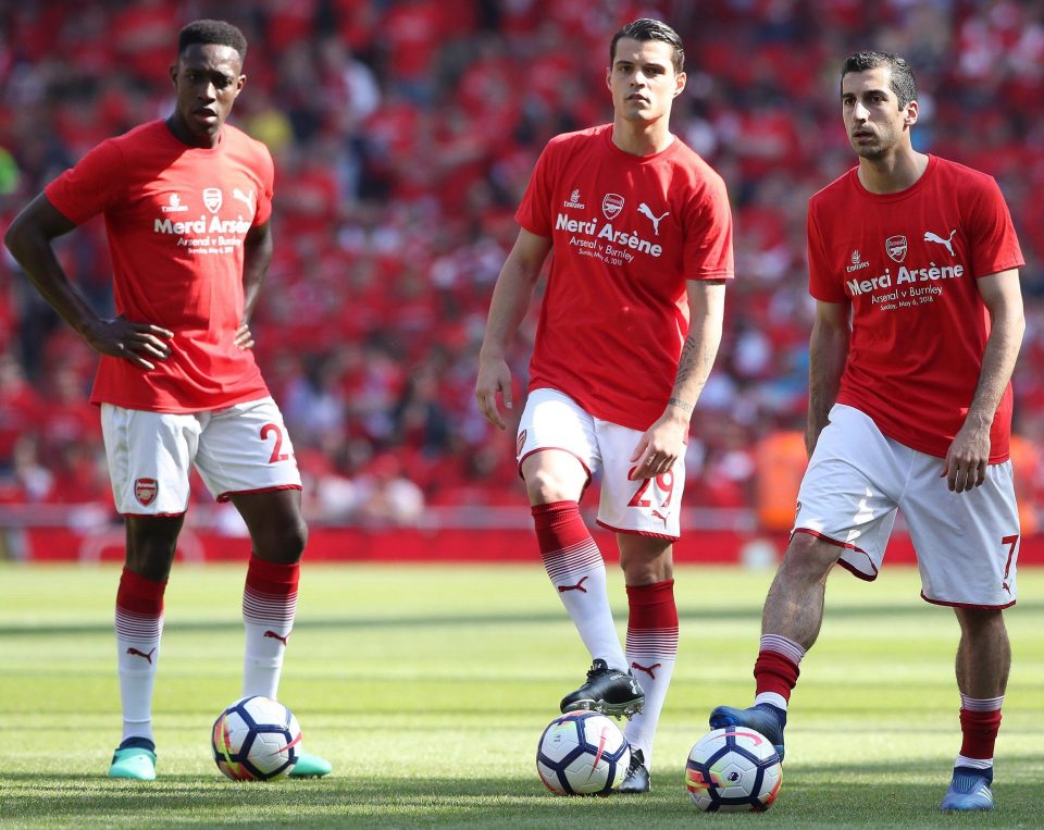  Arsenal's Danny Welbeck, Granit Xhaka and Henrikh Mkhitaryan wearing 'Merci Arsene' T-shirts