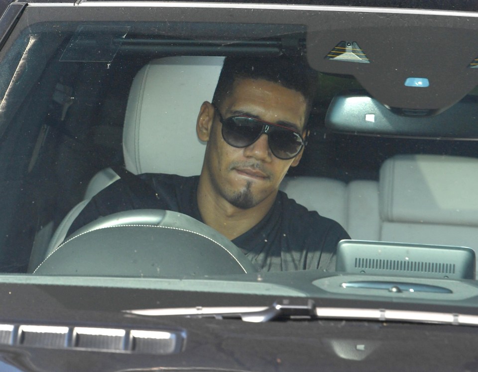 Chris Smalling wears shades to block out the May sunshine