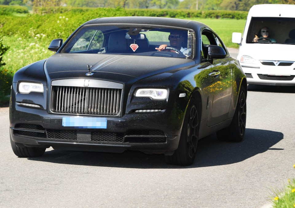 Paul Pogba looks ready for the sunny weather as he rocks up in sunglasses