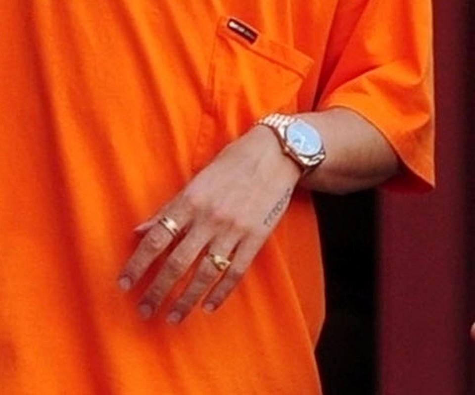  The Arsenal man donned a selection of jewellery including rings on both hands and a necklace