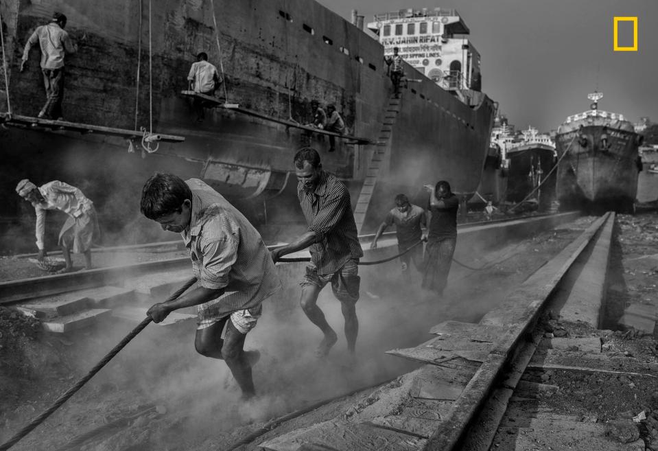  This slum in Dhaka is home to a huge shipyard where 15,000 people, aged between 8 and 80, break down massive vessels. The picture, which captures the crude, dirty and dangerous conditions, was taken by Mauro De Bettio