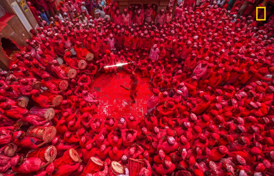  The vivid red image shows Shri Nath Mhaskoba temple is located in the 'Veer' village near Saswad town of Pune, Maharashtra, India. Villagers gather to celebrate God's Marriage ceremony every year where they chant and throw red colour. The scene was captured by Mahesh Lonkar