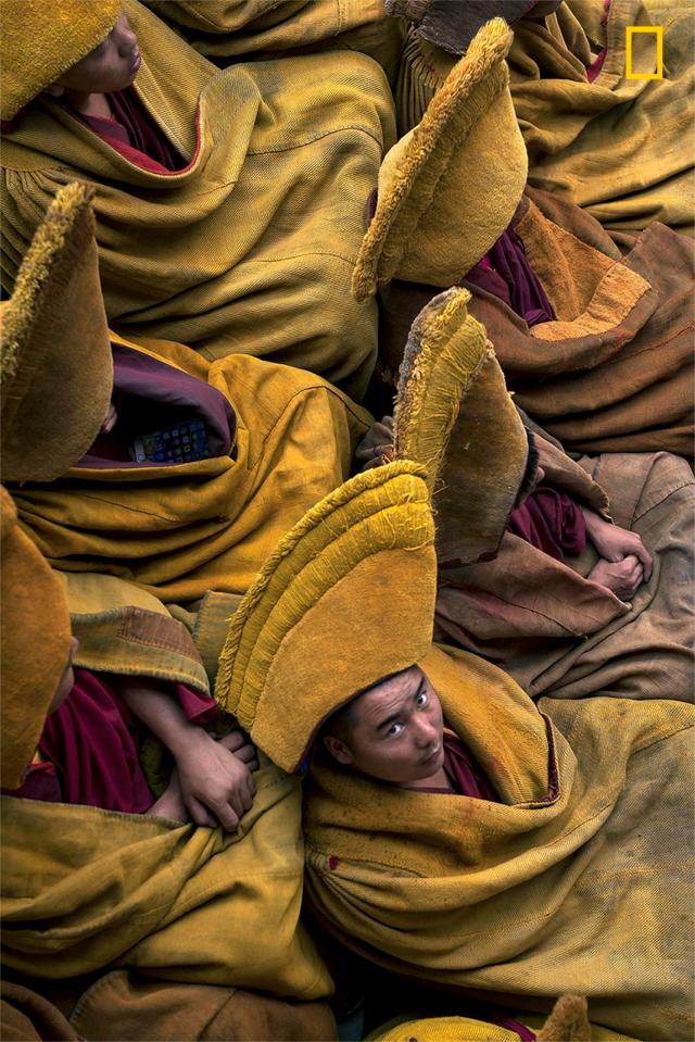  Photographer Mattia Passarini took this intimate portrait of Tibetan Monks during the weekly pray in Tashi LhunPo Monastery in Tibet. It is home to around 2,000 monks