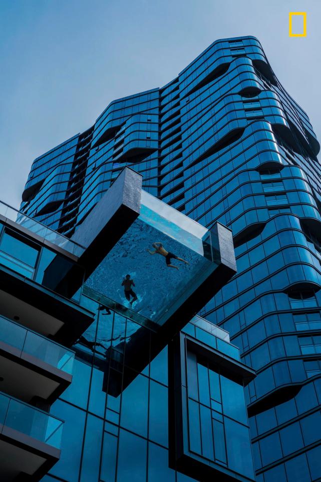  Taken by Peyton Sickles, this stunning image captures a unique view through the glass bottomed swimming pool set in a towering skyscraper in Oahu, Honolulu.