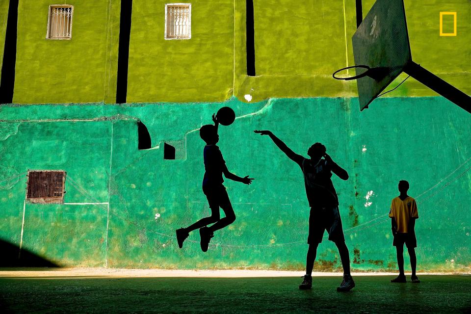  This stunning snap captures the silhouettes of young boys playing basketball in Havana, Cuba, taken by Jeremy Lasky