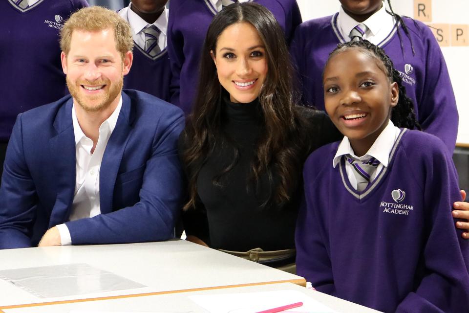  Prince Harry (left) and Meghan Markle (centre) visited 13-year-old schoolgirl Leonora Ncomanzi (right) when they visited the Nottingham Academy