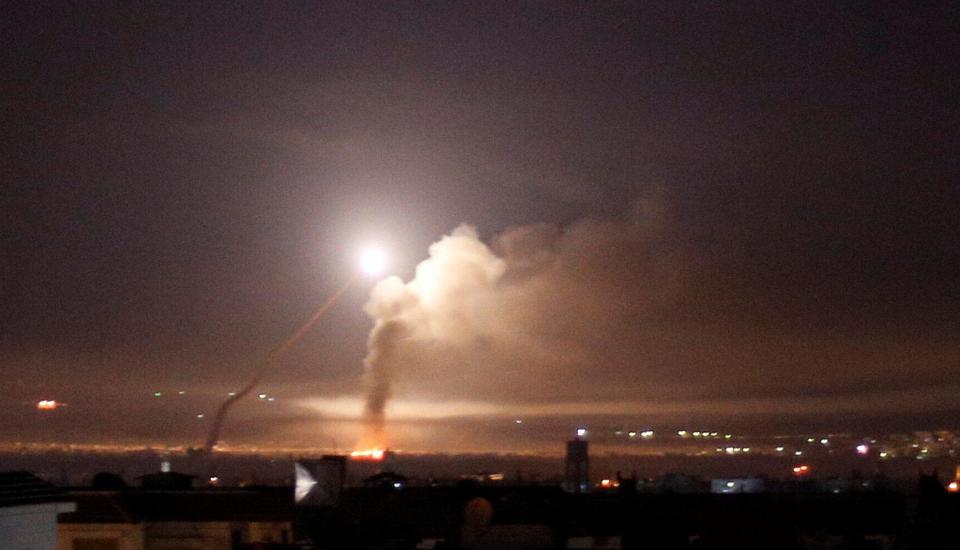  Missiles rise into the sky as Israeli missiles hit an air defence position and other military bases in Damascus, Syria