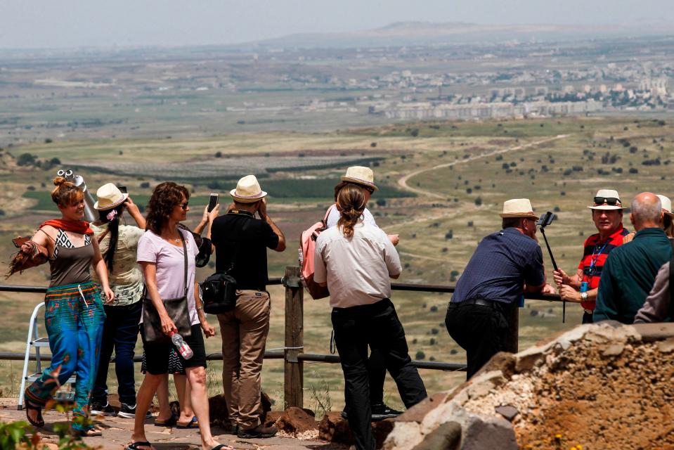  Tourists visit an Israeli army post on Mount Bental in the Israeli-annexed Golan Heights on May 10, 2018