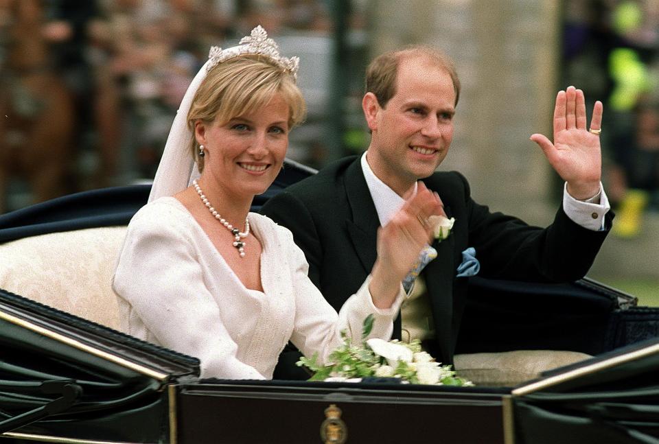  The couple greeted wellwishers during their brief ride around Windsor