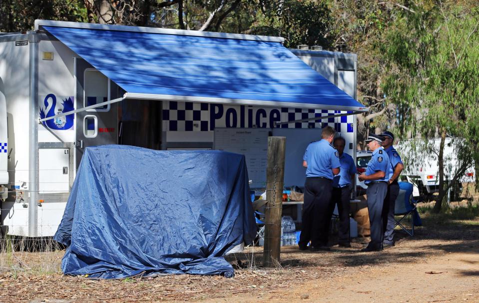  Police forensics investigate the death of seven people in a suspected murder-suicide in Osmington