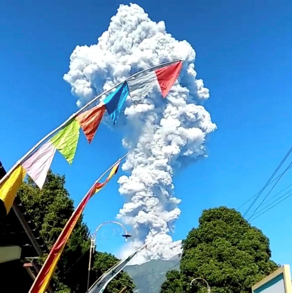  Volcanic ash and sand spews from erupting Mount Merapi in central Java today