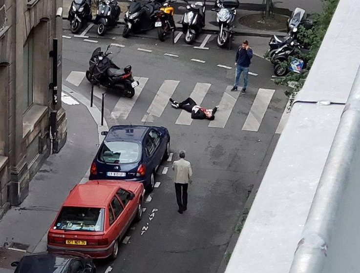  A wounded man is seen on Rue Marsolier