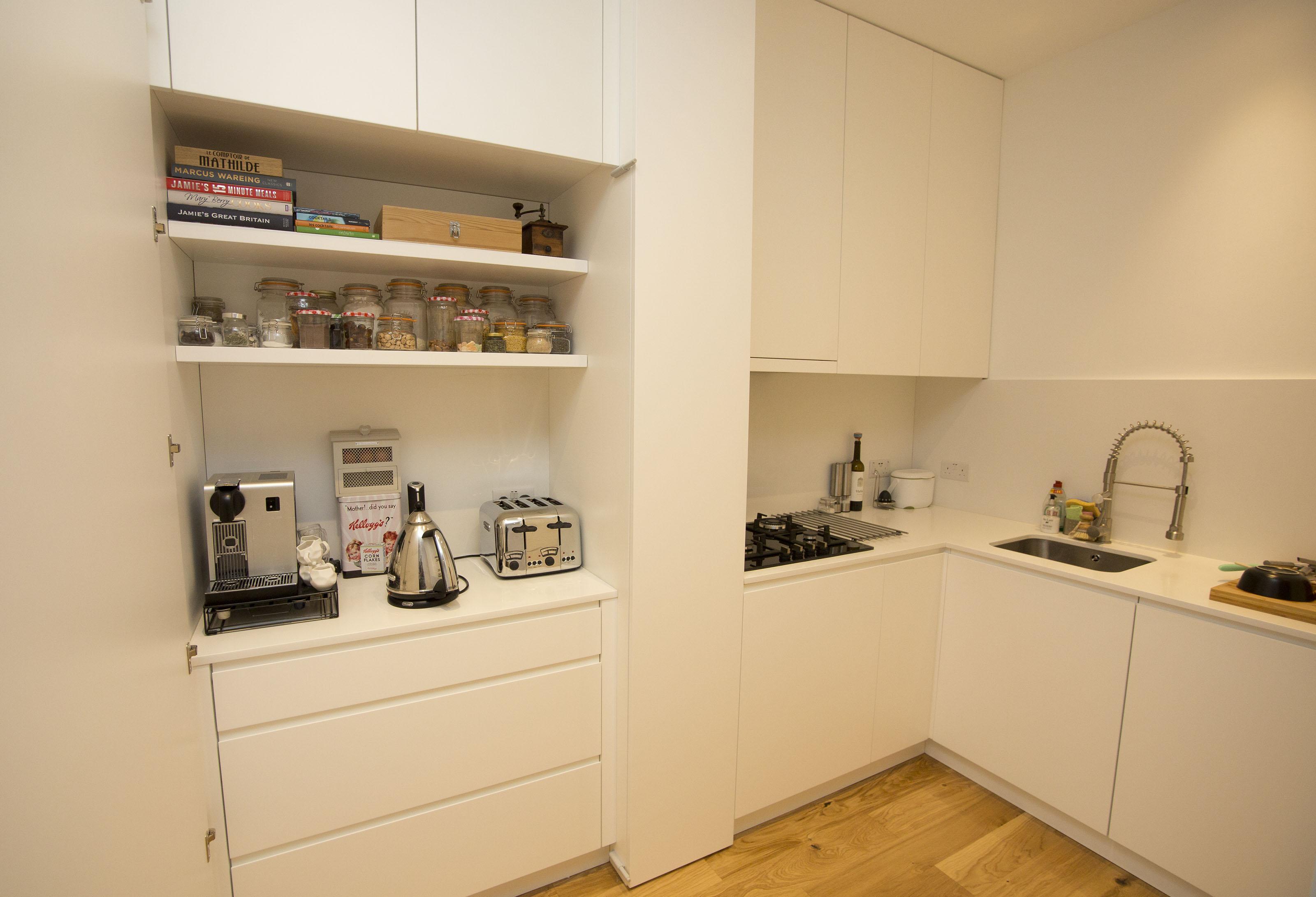 Bespoke kitchen cabinets make clever use of the space in a completely new layout