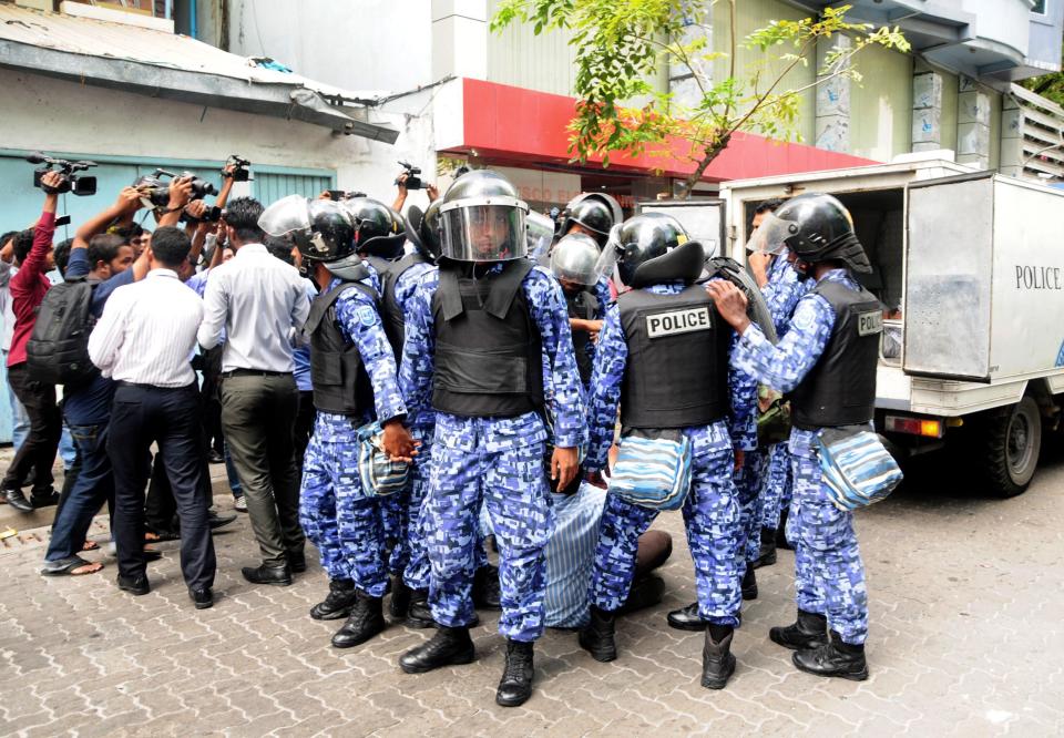  Riot police clash with a support of the country's arrested former President