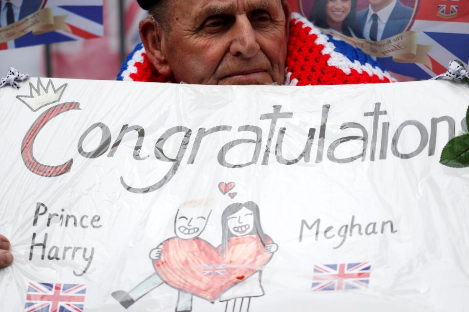  A man holds up a Congratulations sign