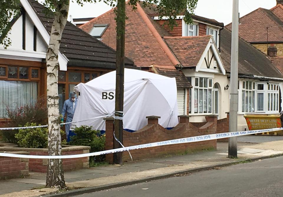  A forensic tent is set up at the 85-year-old's home