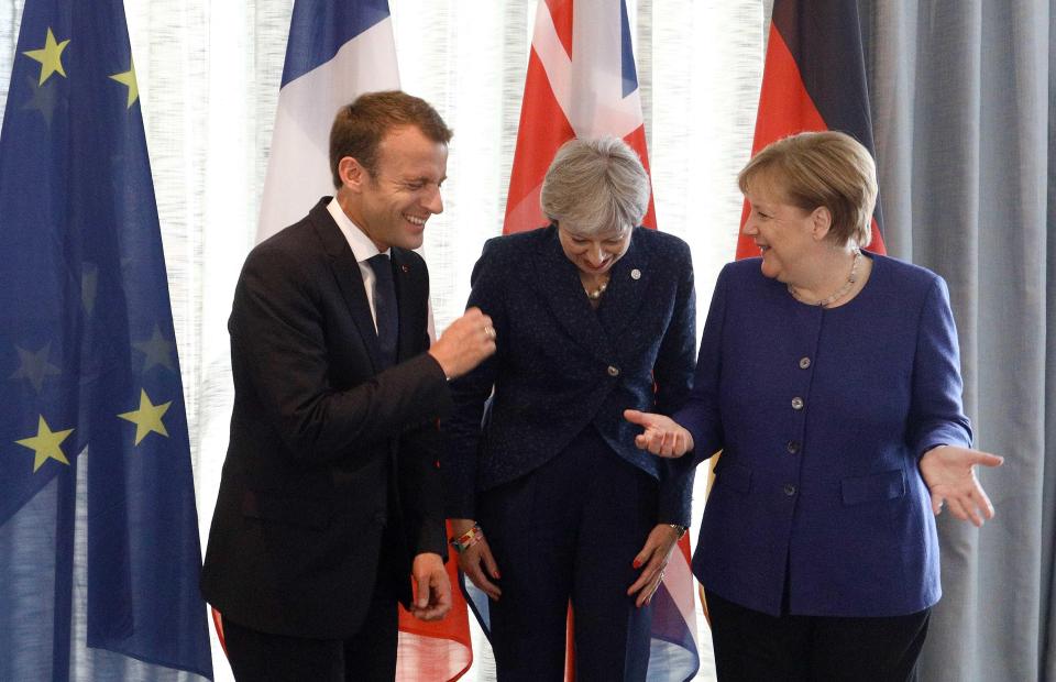  Theresa May has denied Britain will stay in stifling customs union with the EU for longer after Brexit - pictured today sharing a joke with Merkel and Macron