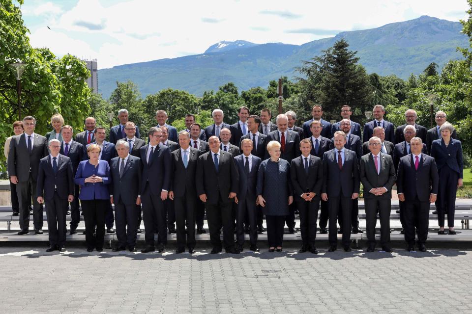  Theresa May could be seen on the far right of the group leaders shot - at a summit encouraging other states to join the EU