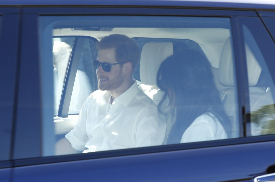 Prince Harry cracks a smile as the pair leave Windsor Castle this afternoon