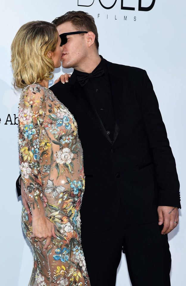  Paris looked smitten with fiance Chris Zylka, who wore an all-black suit