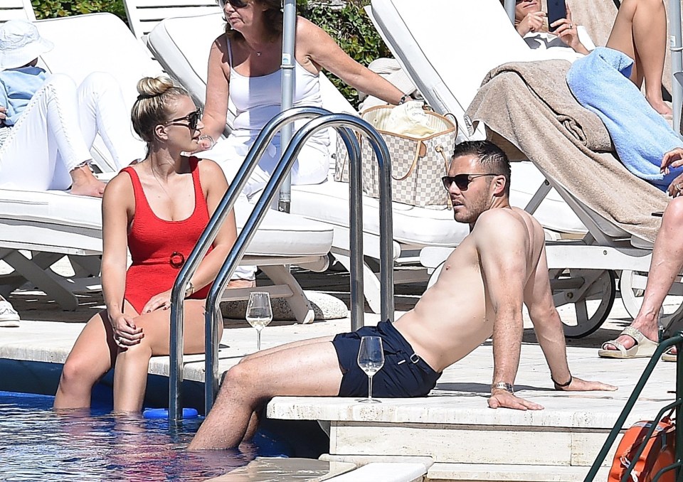 Butland attempted to tan his torso while splashing in the pool