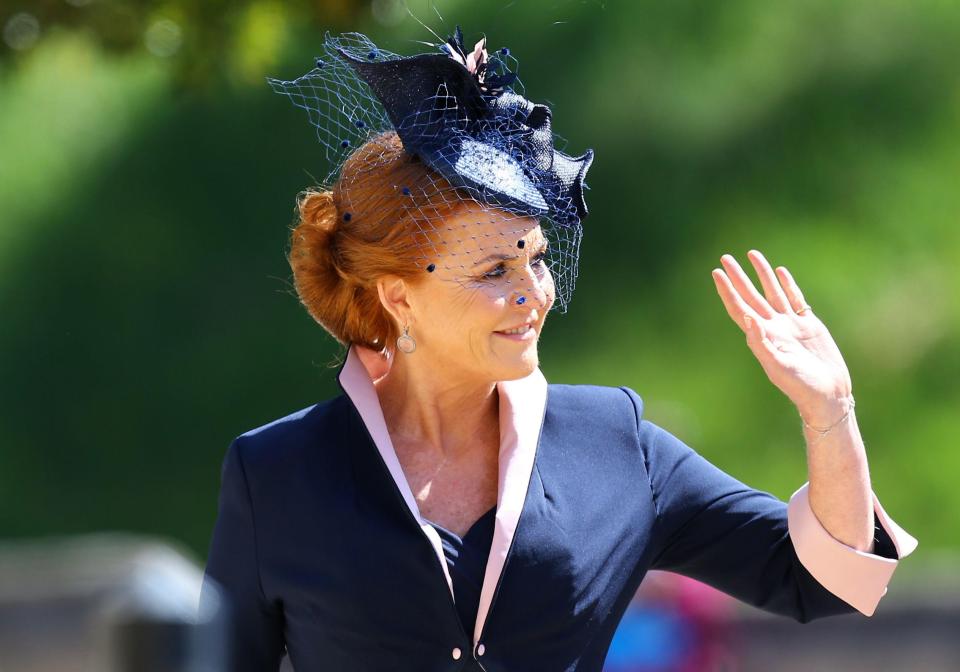  Sarah Ferguson looked elegant in a black fascinator as she waved to fans while walking into the castle