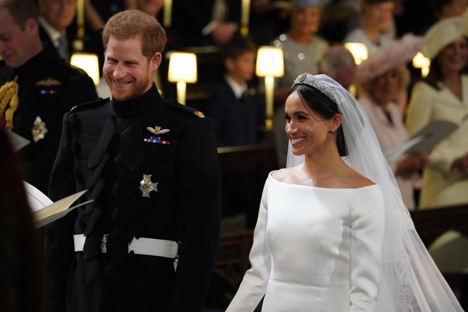  Harry and Meghan chuckle during their emotional wedding ceremony. They were married after a rousing speech by a US bishop and a gospel choir