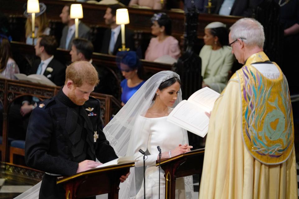  Harry and Meghan sing a hymn during their ceremony - hailed as the most multicultural in history