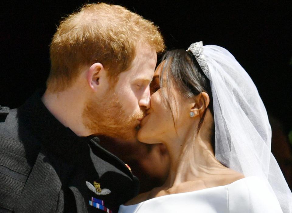  Prince Harry and Meghan Markle share a sweet kiss after tying the knot in a modern ceremony