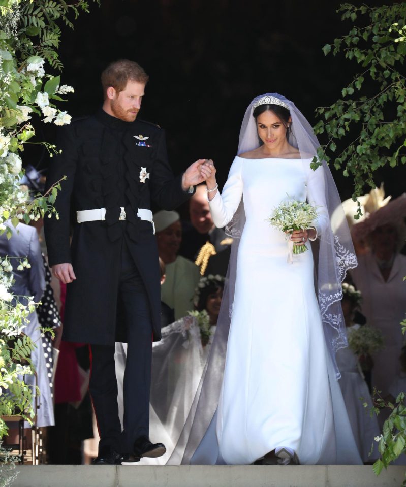  Newlyweds Prince Harry and Meghan Markle step out of St George's Chapel to rapturous applause following the ceremony