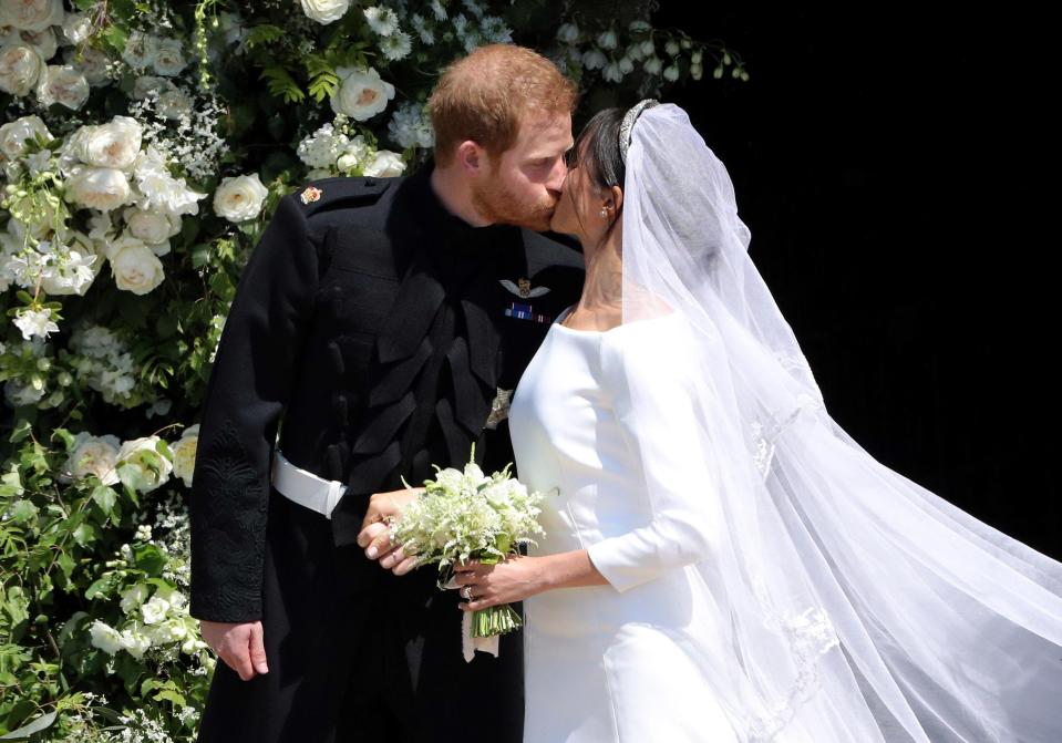 Meghan kisses Harry after after the happy couple tied the knot 