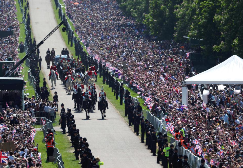  Royal fans pack the streets of Windsor as they cheer on the happy couple