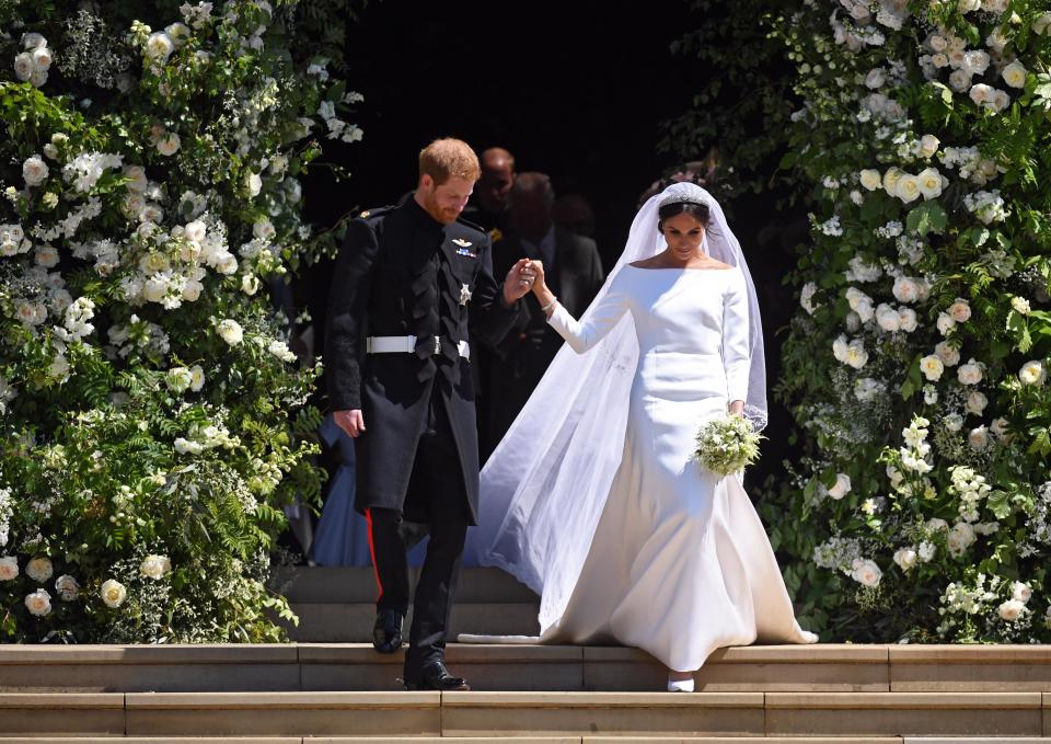 Prince Harry and Meghan leave the ceremony after tying the knot with their vows slightly different to tradition