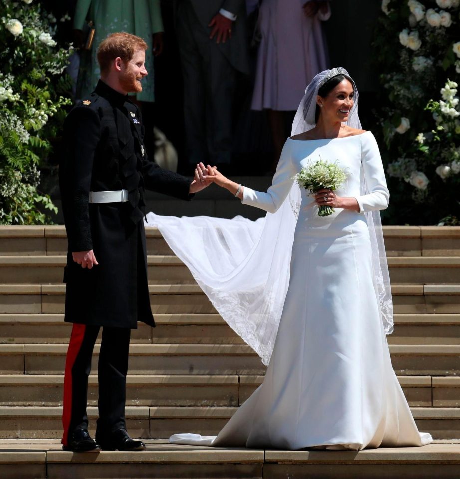  Meghan wore a bespoke ivory silk gown by Givenchy, which she created with Clare Waight Keller