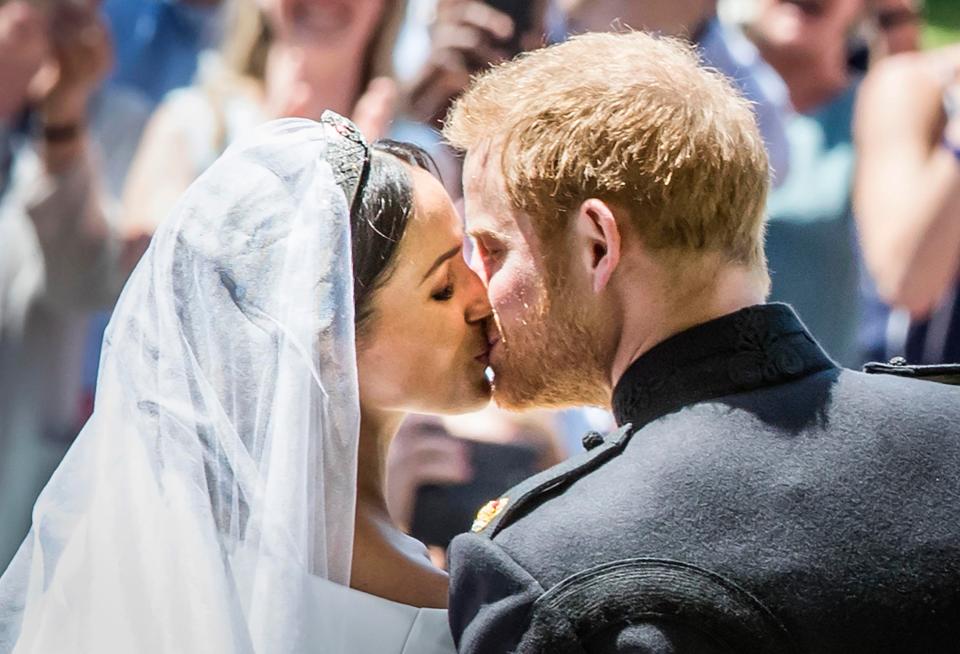  The newlyweds share a kiss in front of adoring fans