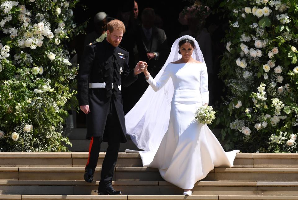  The married couple head outside to be greeted by thousands of well-wishers