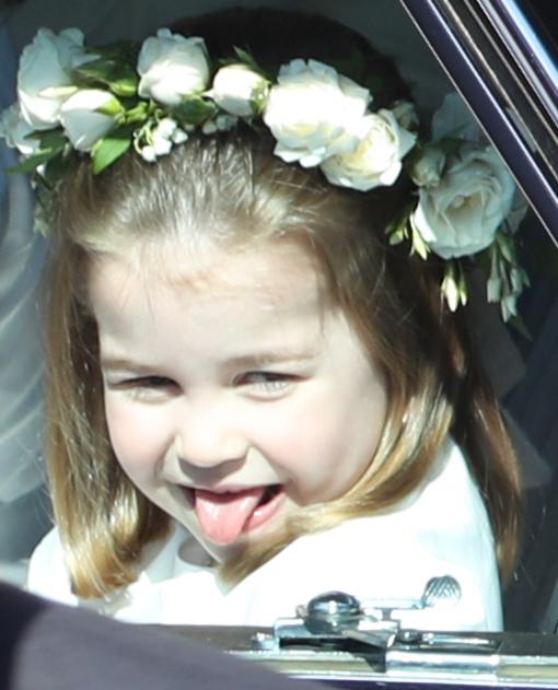  A flower girl brings things back down to earth again with a cheeky poke of the tongue in Windsor