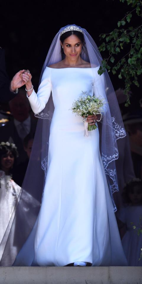  Meghan, Duchess of Sussex exits St George's Chapel in Windsor Castle after the royal wedding ceremony